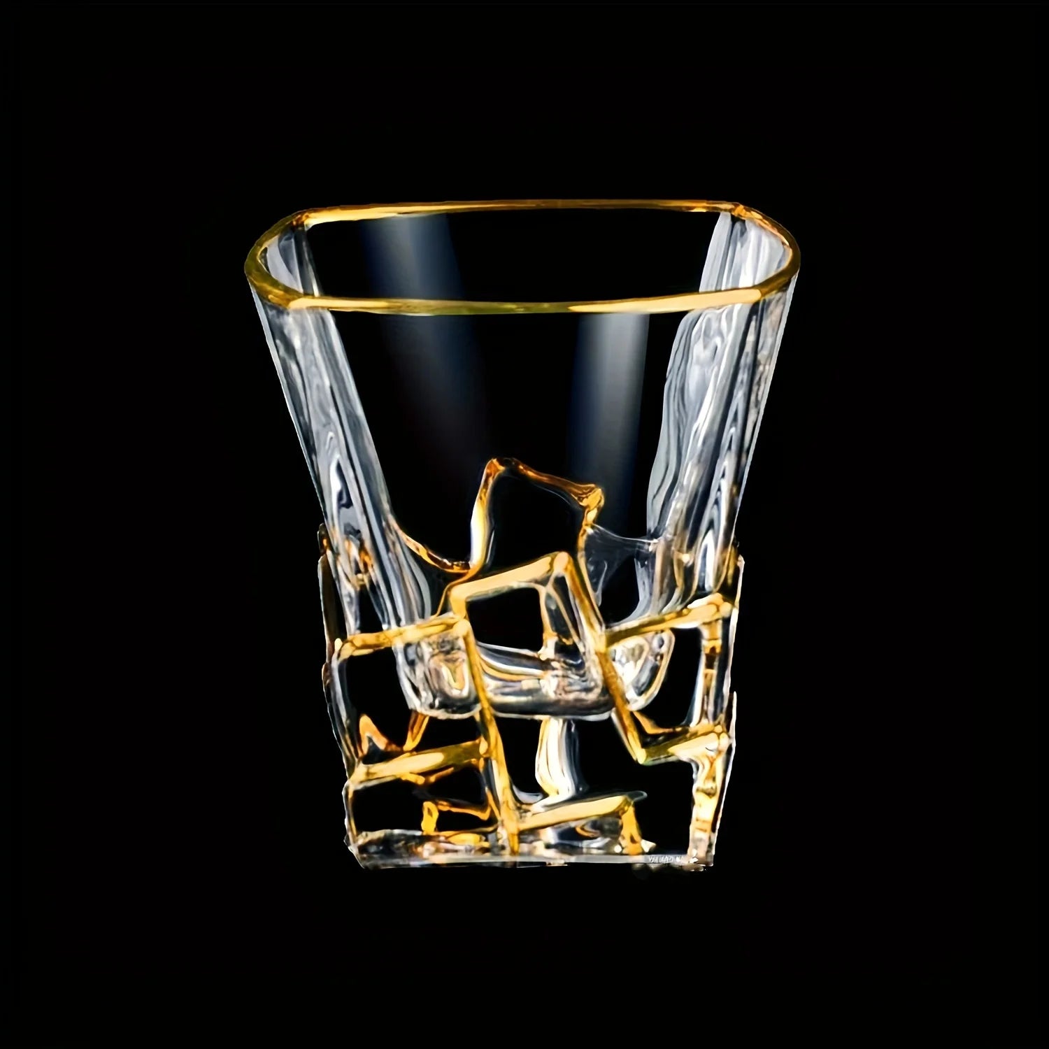 Golden painted crystal tumblers by MC The Black Diamond, multi-functional drinkware glassware set on a neutral background.