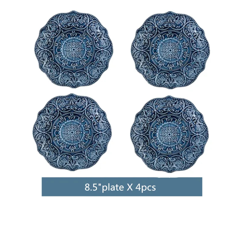 Blue retro relief ceramic dinnerware set by MC THE BLACK DIAMOND featuring multiple plates and bowls on a wooden table.