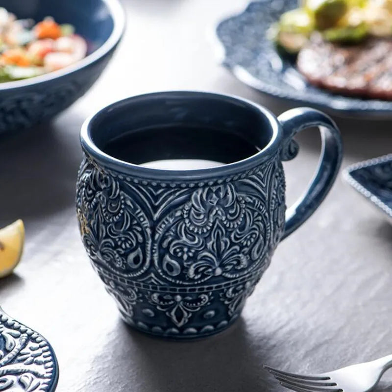Blue retro relief ceramic dinnerware set by MC THE BLACK DIAMOND, featuring matching plates and bowls with vintage-inspired design.