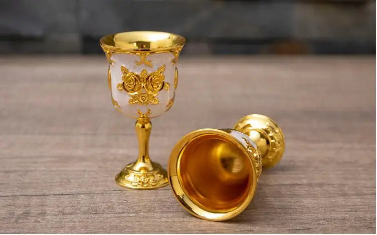 Set of gold and silver decorative cups from MC THE BLACK DIAMOND drinkware set, featuring elegant metallic finishes.