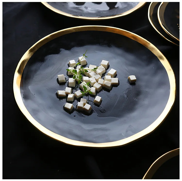 European style gold side black ceramic plate with matte finish, ideal for steak, dessert, and dinner presentations.