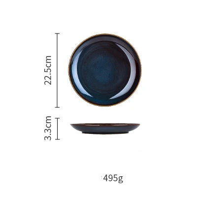 Deep blue ceramic dinnerware set by MC THE BLACK DIAMOND, featuring plates and bowls with a sleek, glossy finish.