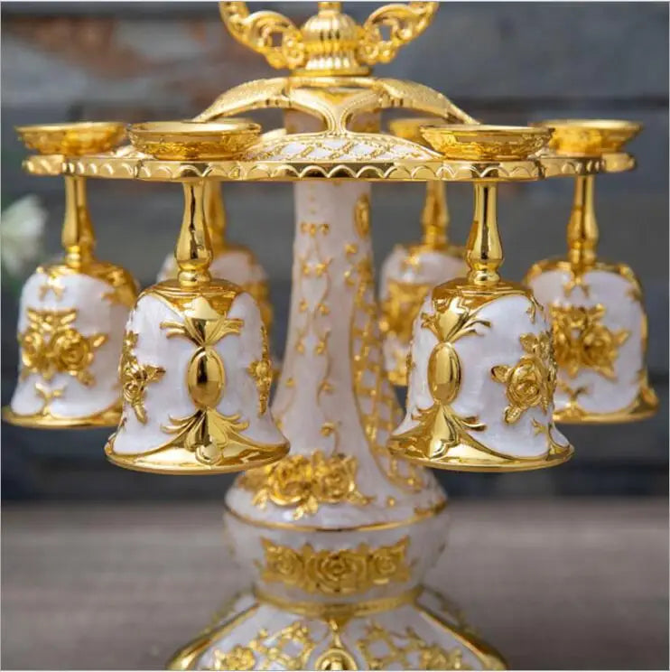 Gold and silver decorative cups from MC THE BLACK DIAMOND drinkware set, featuring elegant, shiny metal finishes.
