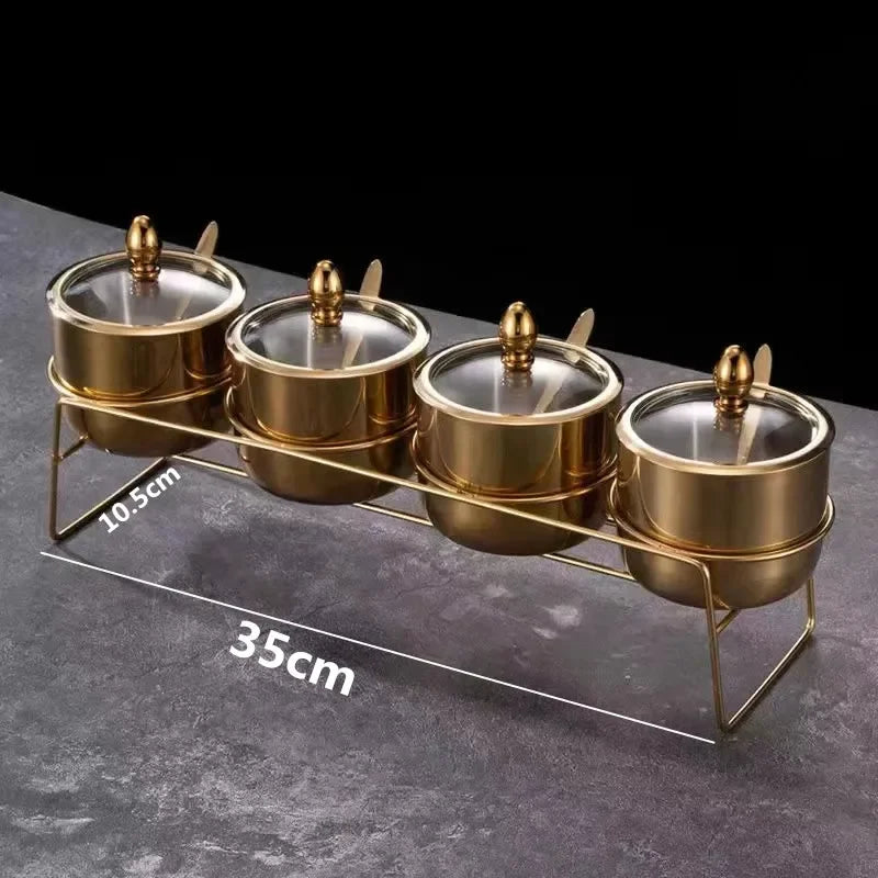 MC THE BLACK DIAMOND golden seasoning box with glass cap, spoon, and flavoring tank for kitchen use.