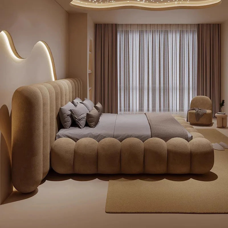Large comfortable bed by MC THE BLACK DIAMOND with soft bedding and pillows, showcasing a cozy sleeping setup.