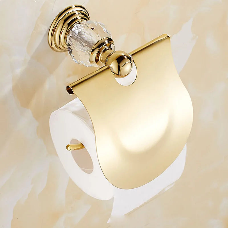 Luxury gold polished brass bathroom accessories set by MC THE BLACK DIAMOND, includes soap dish, tumbler, and tissue holder.