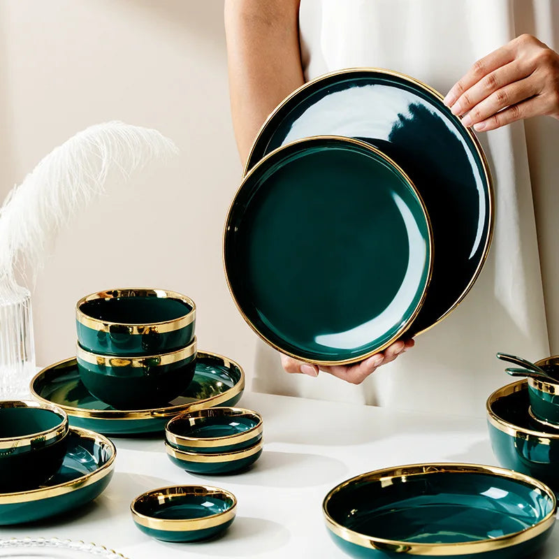 Dark green ceramic cutlery bowls set with gold-plated accents, featuring rice bowls and porcelain dishes for kitchen use.