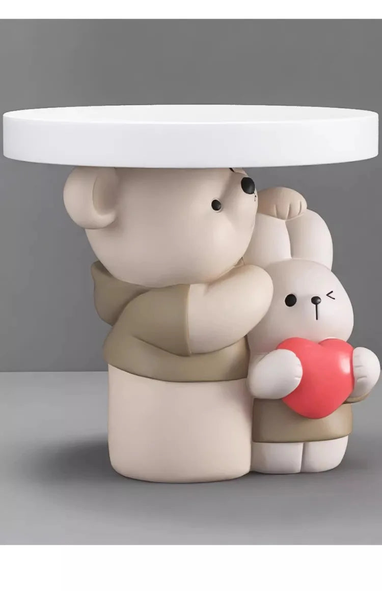 Cream-colored MC THE BLACK DIAMOND parent-child bear statue coffee table with playful bear figures on a smooth surface.