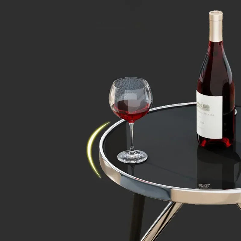 Modern round end table with glass top and stainless steel frame by MC THE BLACK DIAMOND