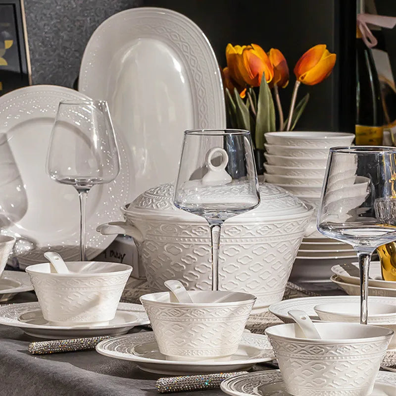 Elegant ceramic dinnerware set by MC THE BLACK DIAMOND, featuring plates and bowls with a luxurious design.