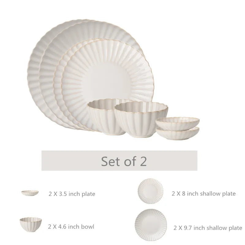 White chrysanthemum-shaped ceramic dinnerware set by MC THE BLACK DIAMOND, featuring elegant flower-shaped plates and bowls.