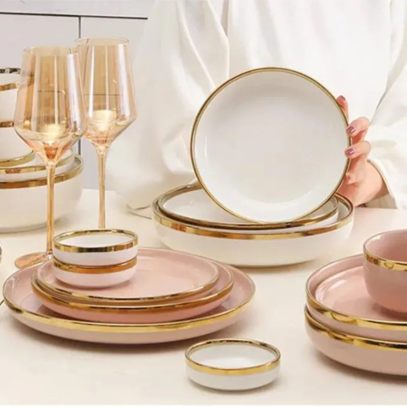 Set of bright white and pink porcelain plates with gold accents from MC THE BLACK DIAMOND for elegant kitchen tableware.