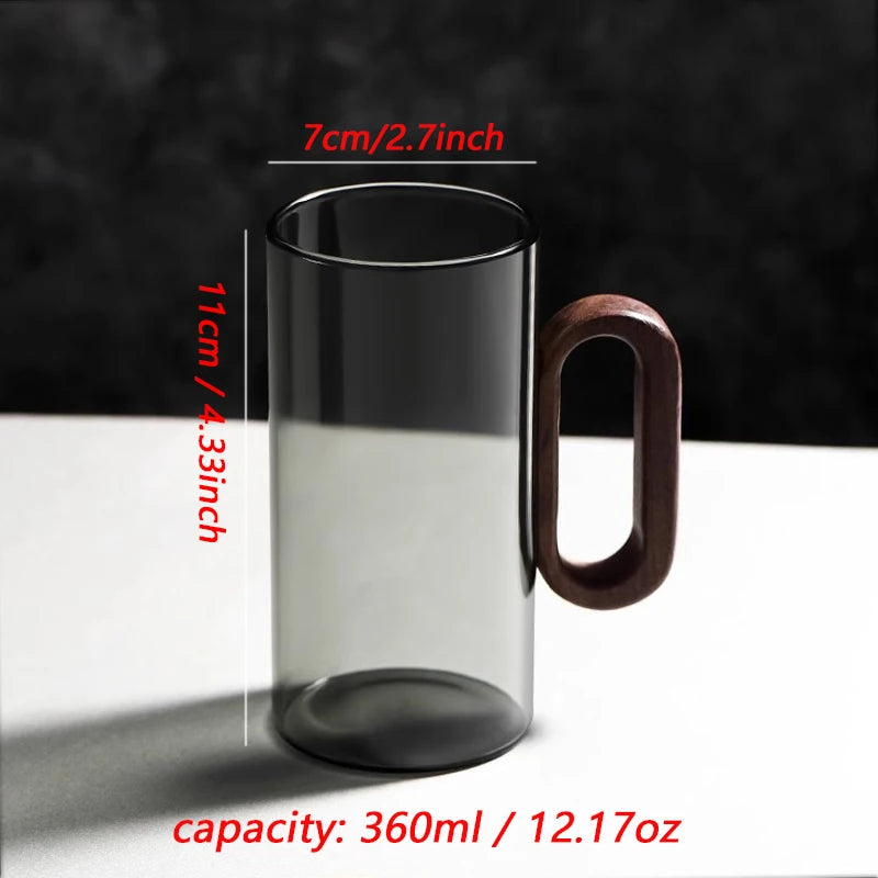 Glass mug with wooden handle from MC THE BLACK DIAMOND drinkware set, showcasing a stylish, heat-resistant design.