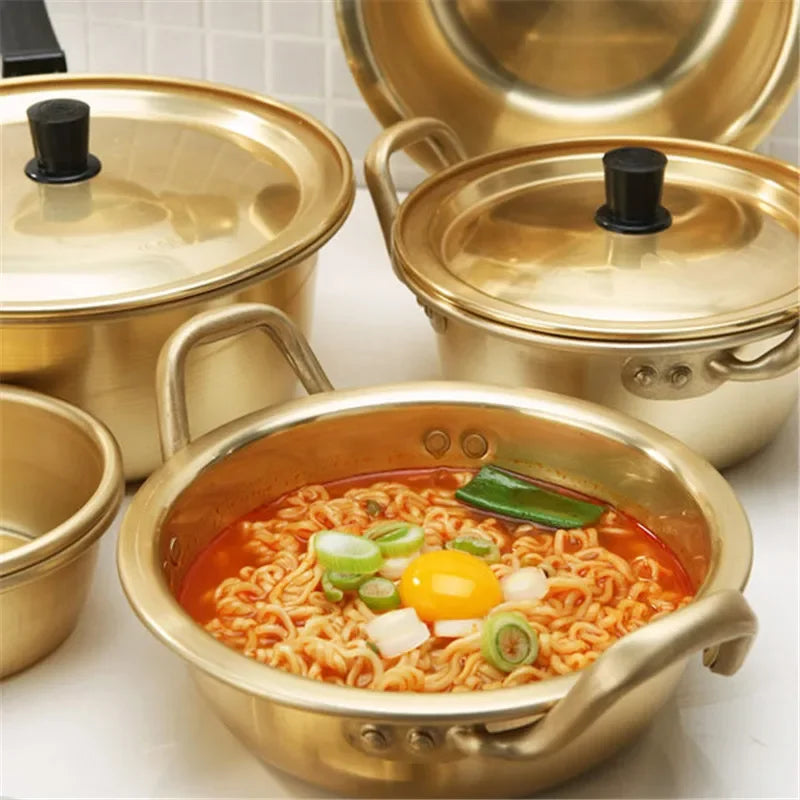 Gold aluminum stock pot for cooking, durable kitchen cookware by MC THE BLACK DIAMOND with sturdy handles, ideal for boiling and simmering.