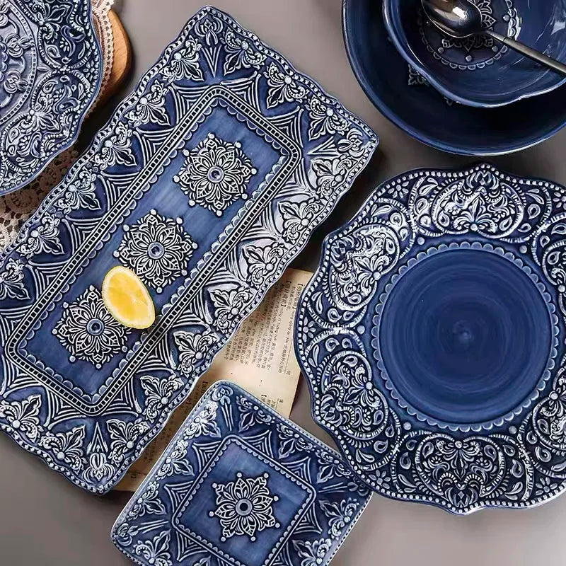 Blue retro relief ceramic dinnerware set by MC THE BLACK DIAMOND, featuring various dishes with textured relief designs.