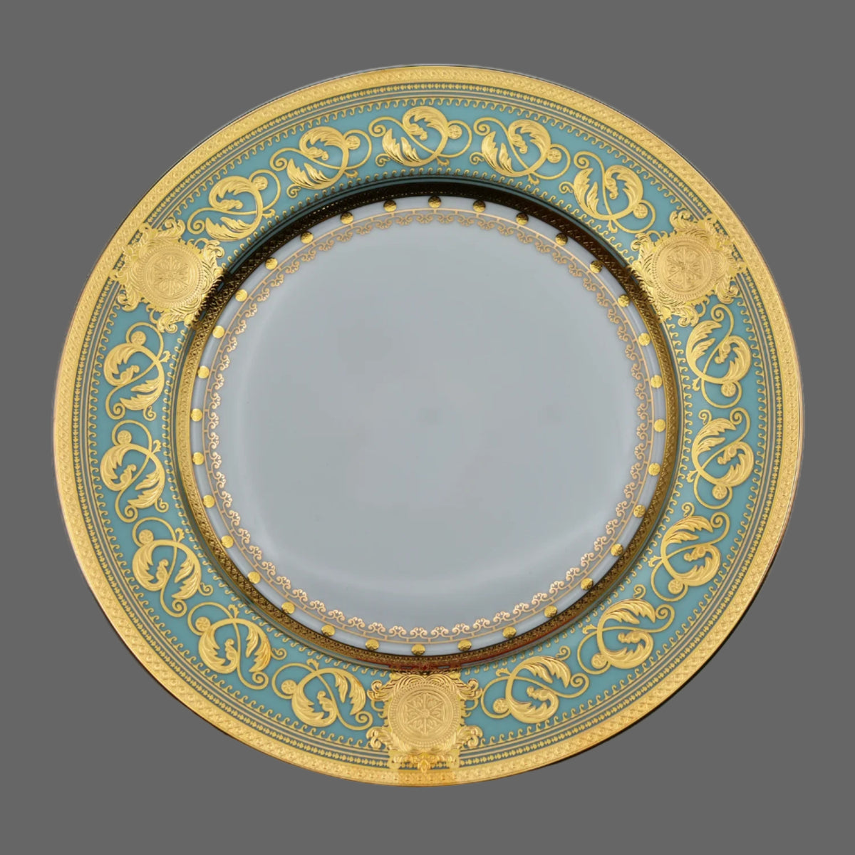 Embossed gold porcelain dinnerware set by MC THE BLACK DIAMOND featuring elegant plates and bowls with luxurious embossed details.
