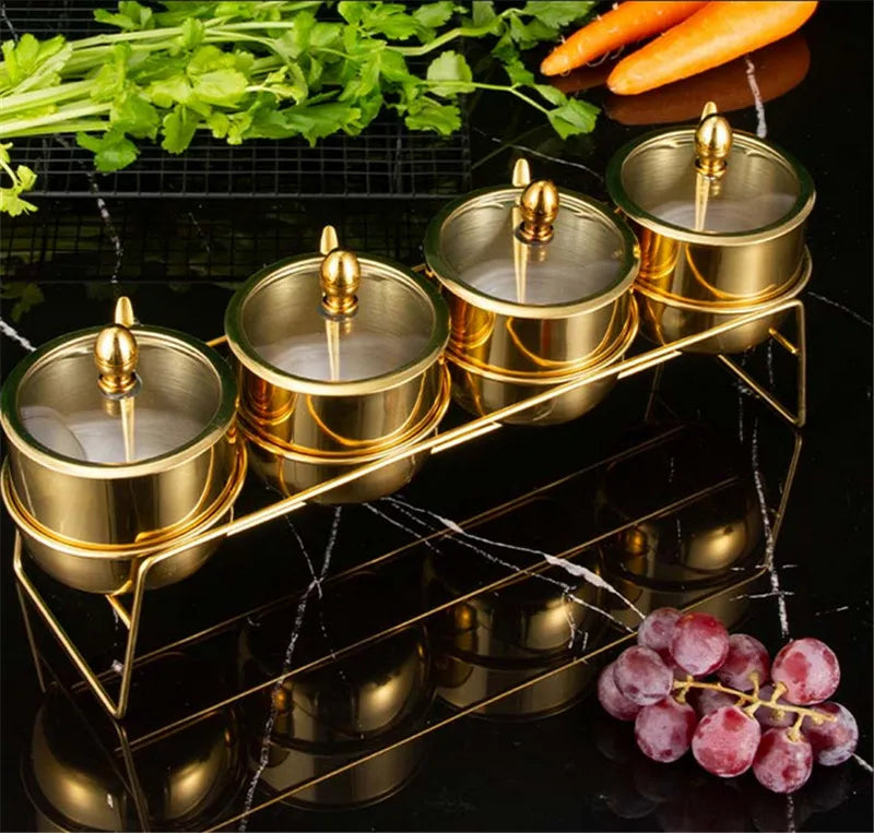 MC THE BLACK DIAMOND golden seasoning box with glass cap, spoon, and flavoring tank for kitchen seasoning storage.
