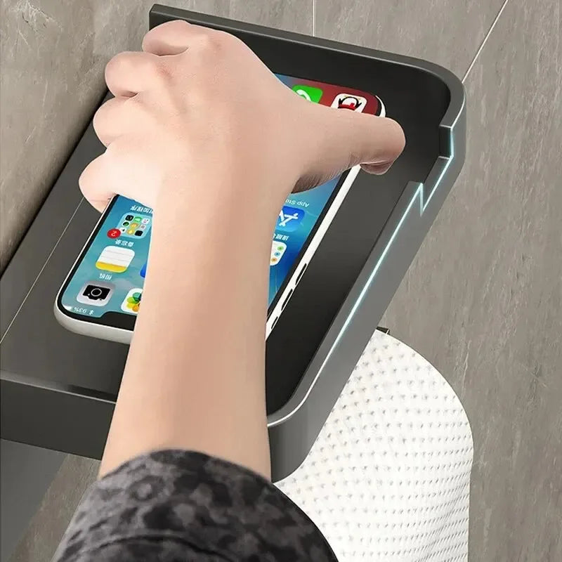 Plastic toilet paper holder from MC THE BLACK DIAMOND, mounted on wall for easy access and organization.