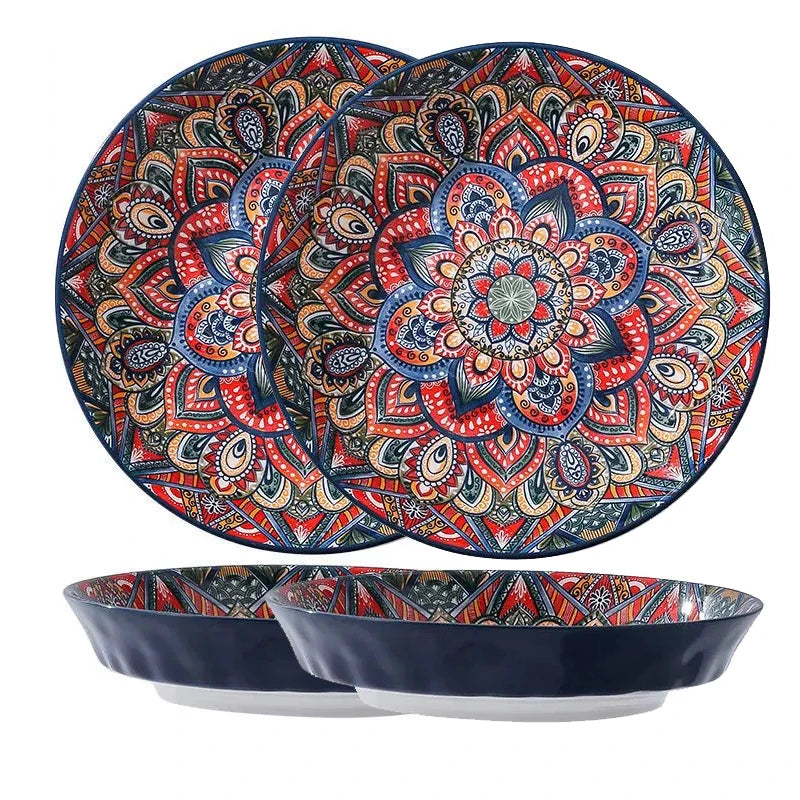 Bohemian ceramic dinnerware set by MC THE BLACK DIAMOND with unique floral pattern, includes plates and bowls arranged on a table.