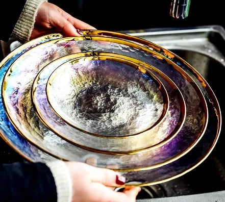 Thick rainbow glass dinner plate with vibrant multicolor pattern, ideal for serving steaks and main courses.