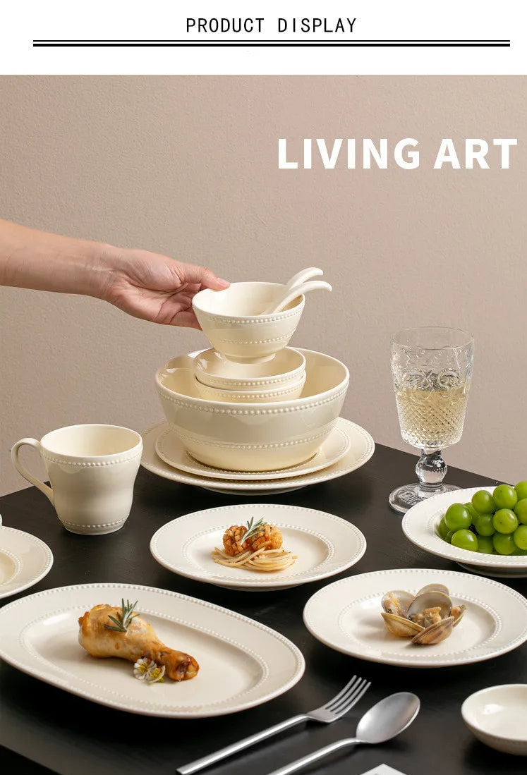 Modern minimalist ceramic dinnerware set by MC THE BLACK DIAMOND, round plates and bowls arranged on a table.
