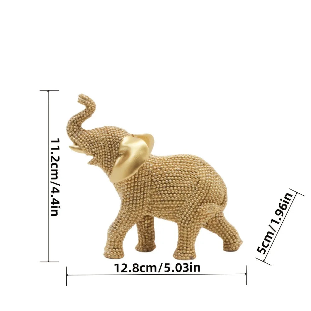 Golden elephant beaded figurine by MC THE BLACK DIAMOND, decorative animal ornament for good luck and holiday home decor.