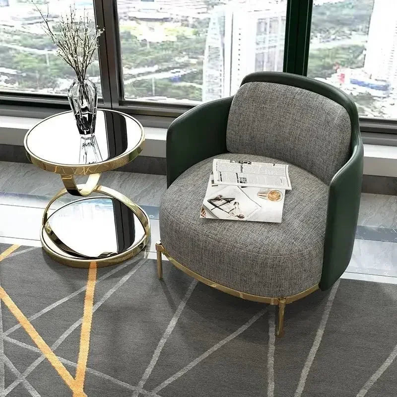 Modern round end table with stainless steel frame and glass top, sleek design by MC THE BLACK DIAMOND.