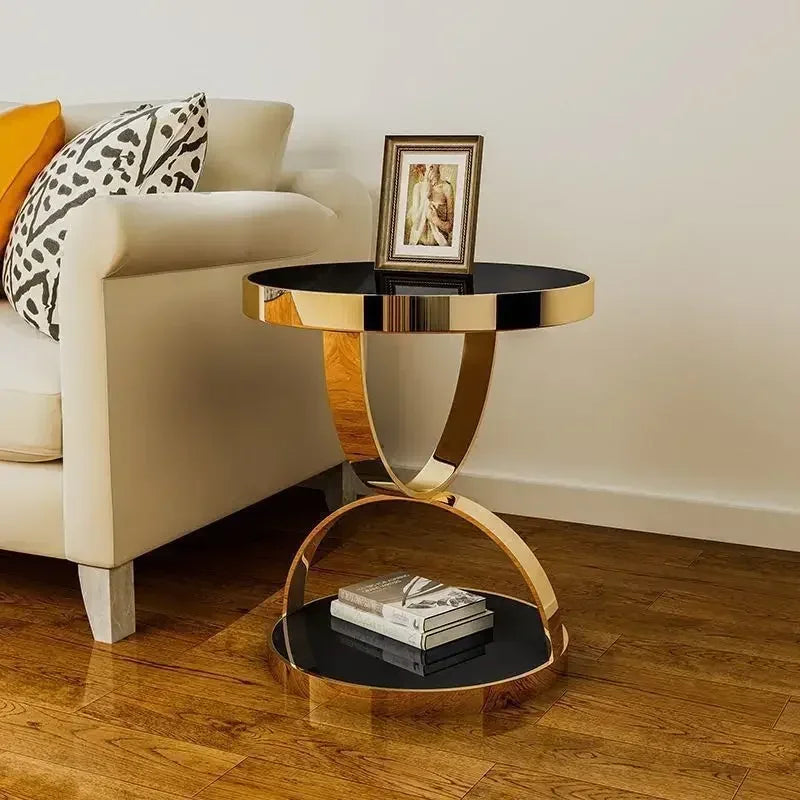 Modern round end table with glass top and stainless steel frame by MC THE BLACK DIAMOND, showcasing a sleek, contemporary design.
