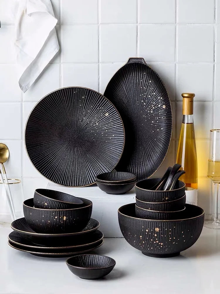 Luxury Golden Black MC THE BLACK DIAMOND dinnerware set with elegant plates and bowls, featuring a sophisticated black and gold design.