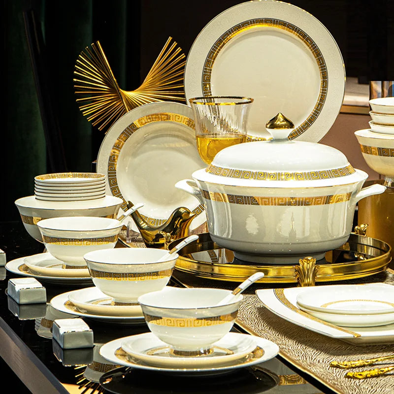 Elegant MC THE BLACK DIAMOND dinnerware set with white plates and bowls, perfect for serving guests with a touch of luxury.