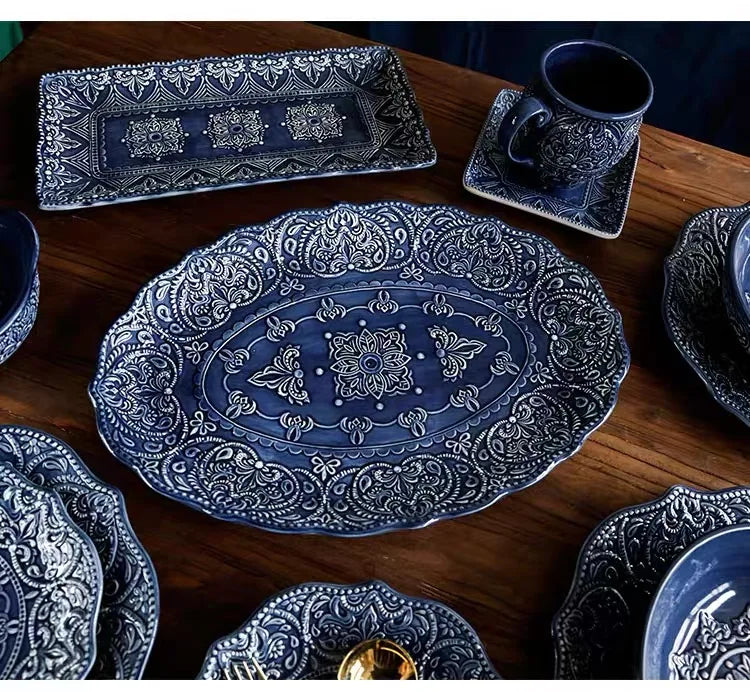 Blue retro relief ceramic dinnerware set by MC THE BLACK DIAMOND, featuring multiple stylish dishes for serving and dining.