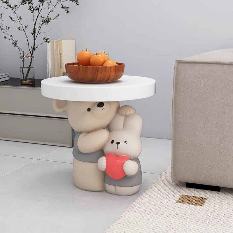 Cream-colored MC THE BLACK DIAMOND parent-child bear statue coffee table with detailed bear figures on a smooth surface.