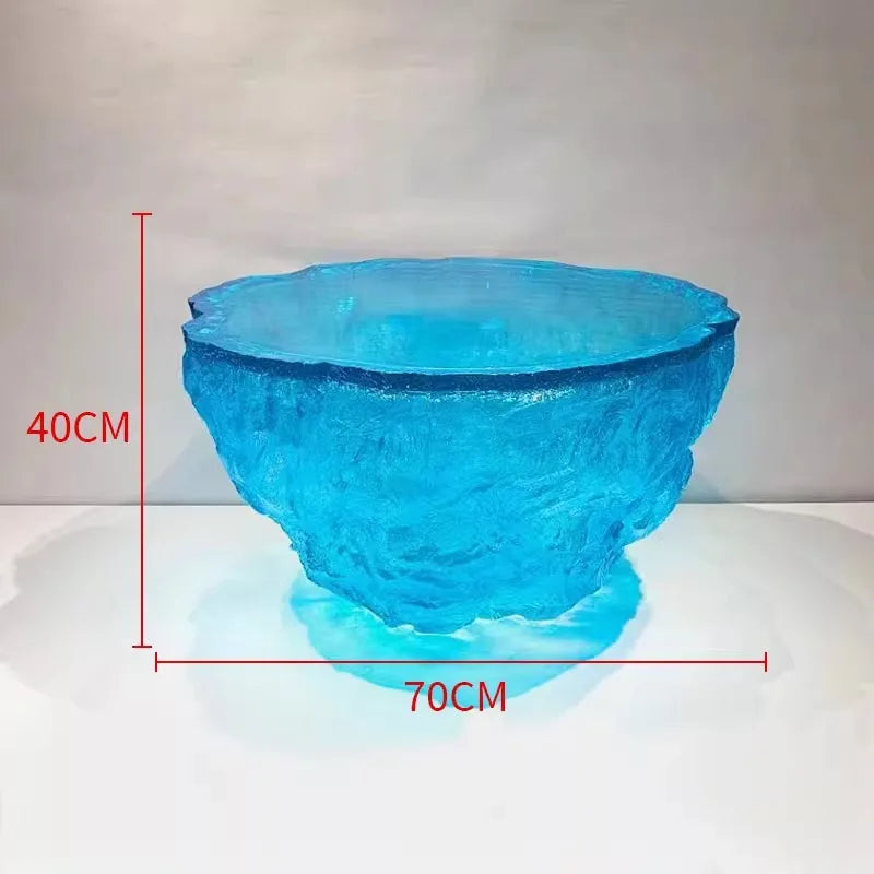 Transparent resin coffee table by MC THE BLACK DIAMOND with sleek, modern design and clear glass-like surface.
