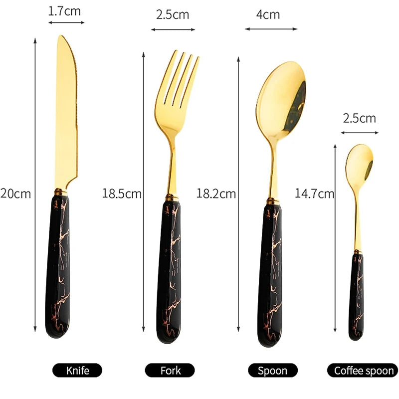 MC THE BLACK DIAMOND stainless steel cutlery set with knives, forks, and spoons arranged on a table.