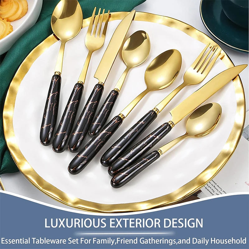 Set of stainless steel flatware including knives, forks, and spoons from MC THE BLACK DIAMOND, neatly arranged on a table.