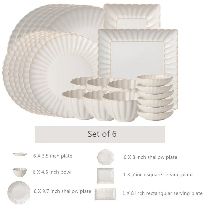 White chrysanthemum shaped ceramic dinnerware set by MC THE BLACK DIAMOND, featuring elegant plates and bowls with floral design.