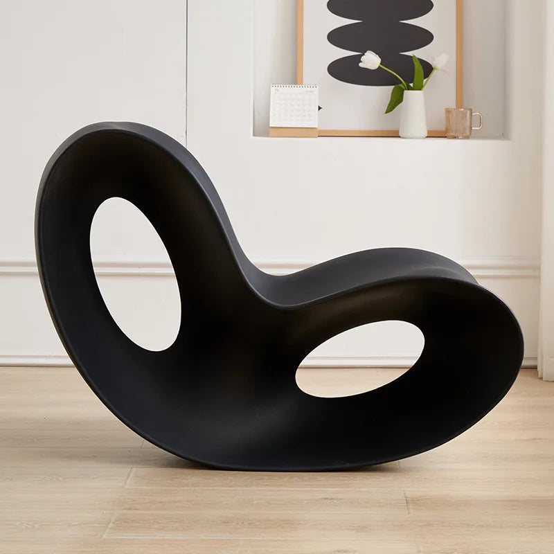 Modern MC THE BLACK DIAMOND rocking lounge chair made of durable polyethylene, featuring a sleek, rotational-molded design for comfortable seating.