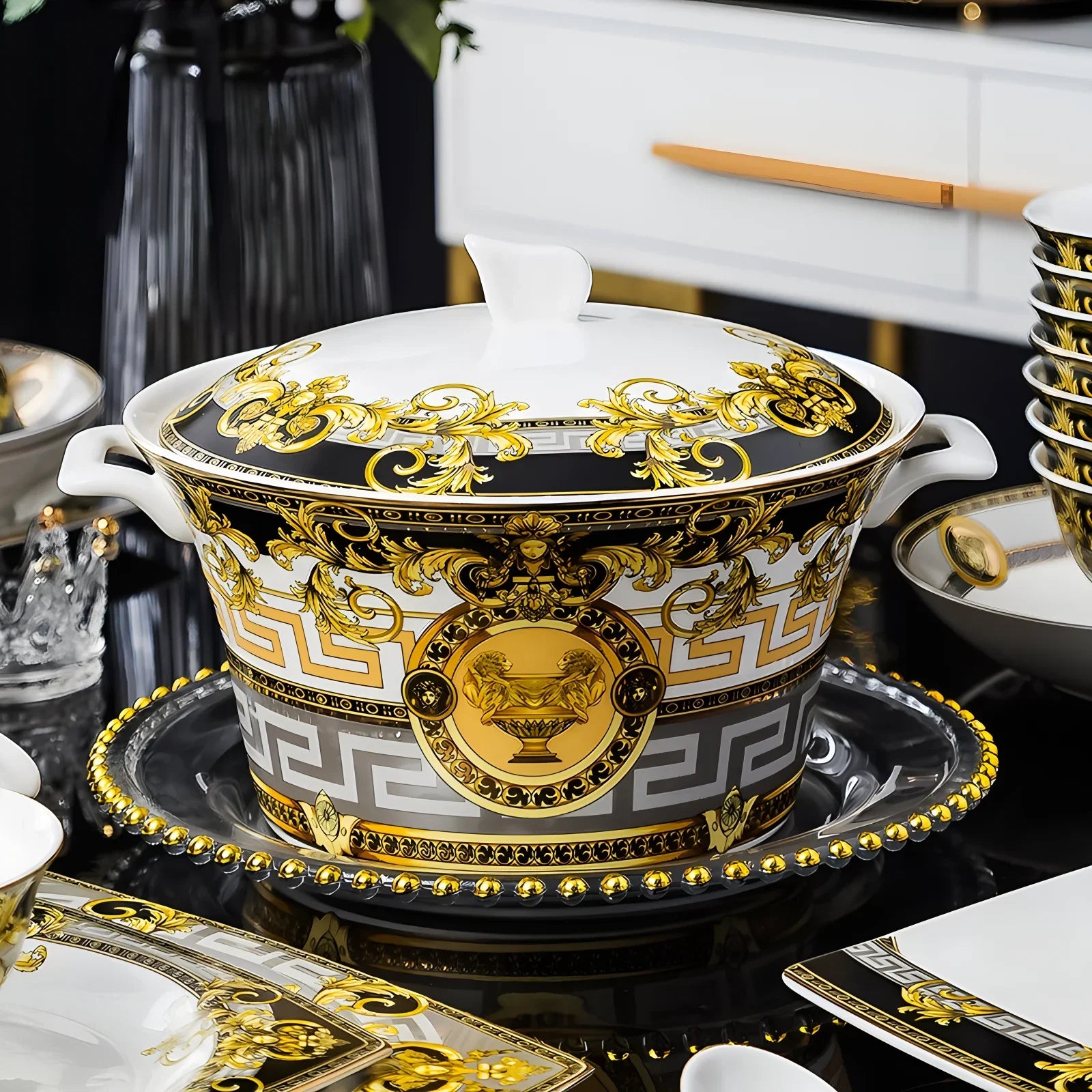Ceramic dinnerware set by MC THE BLACK DIAMOND, including plates, bowls, and mugs arranged on a table.