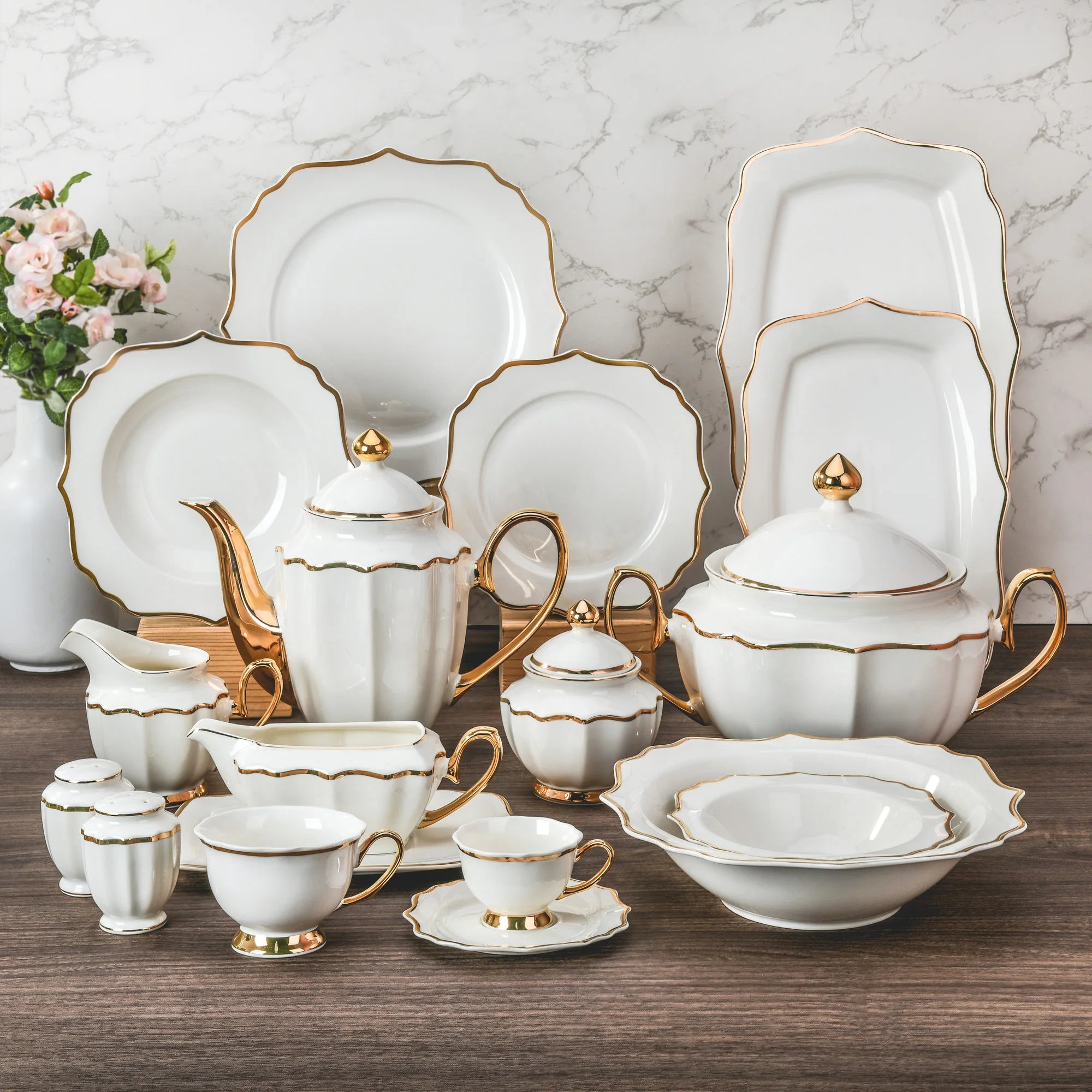 Elegant porcelain dinnerware set by MC THE BLACK DIAMOND, featuring plates, bowls, and cups for luxurious table setting.