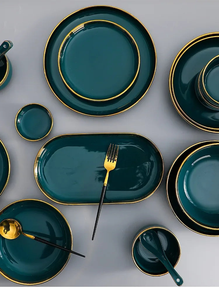 Green ceramic dinnerware family set by MC THE BLACK DIAMOND, includes plates, bowls, and mugs in a coordinated style.