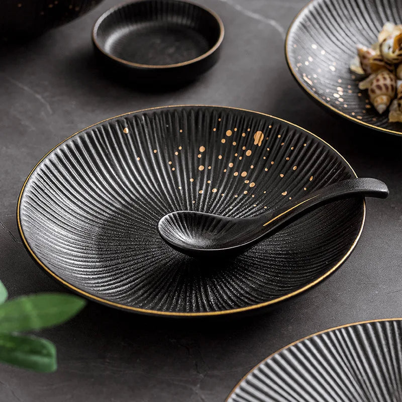 Set of ceramic dinnerware bowls and cutlery from MC THE BLACK DIAMOND, showcasing elegant tableware for dining.