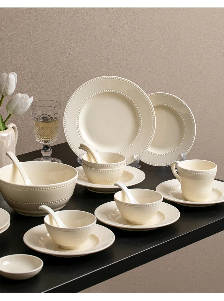 Modern minimalist ceramic round dinnerware set by MC THE BLACK DIAMOND, includes plates and bowls with sleek, simple design.