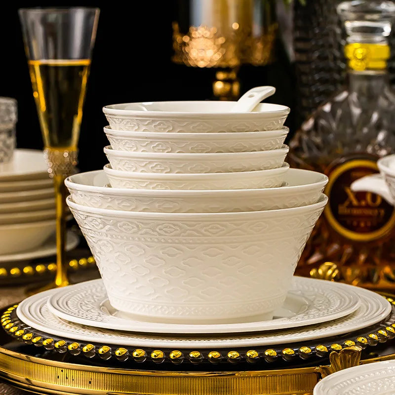 Luxury ceramic dinnerware set by MC THE BLACK DIAMOND featuring elegant white plates and bowls on a stylish table setting.