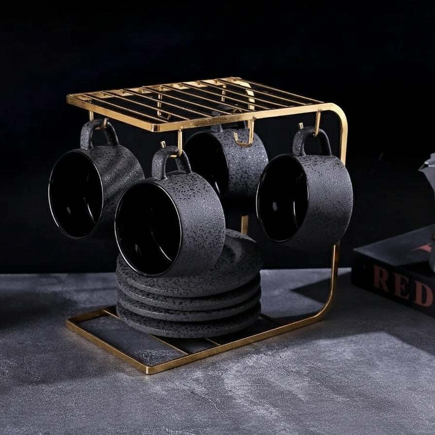 Black ceramic coffee cup and saucer set with spoon and cup holder, part of MC THE BLACK DIAMOND coffee and tea set collection.