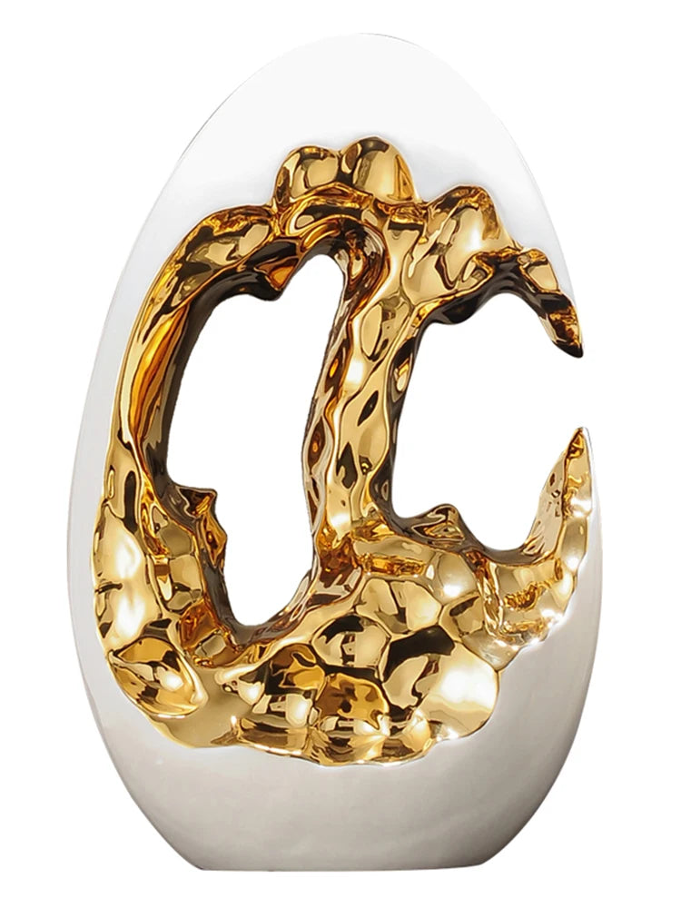 Gold figurines from MC THE BLACK DIAMOND decor set displayed on a living room TV cabinet and office desktop.