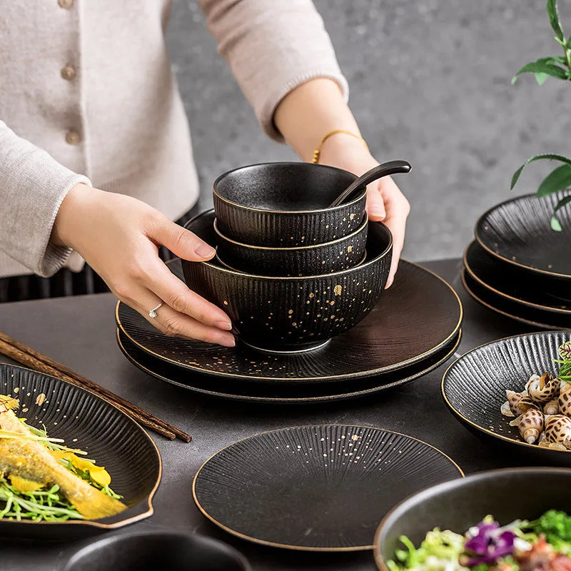 Ceramic dinnerware set with bowls and cutlery by MC THE BLACK DIAMOND, ideal for kitchen and table setting.