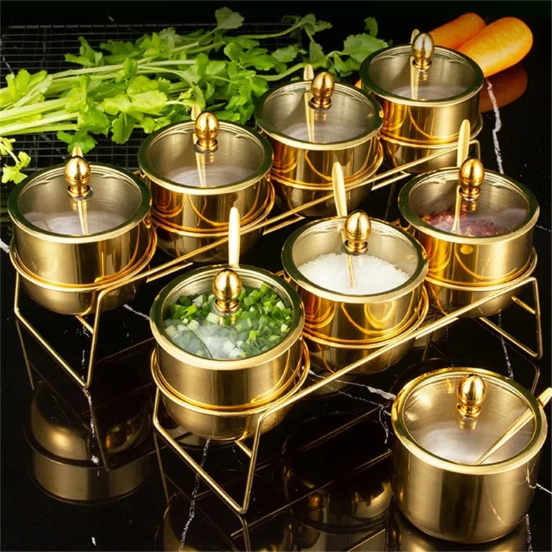 Golden Seasoning box with glass cap, spoon, and flavoring tank from MC THE BLACK DIAMOND kitchen tools, showing a close-up of the container