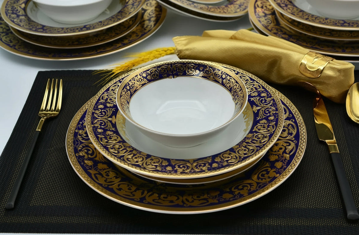 Royal Style embossed gold rim ceramic dinner set by MC THE BLACK DIAMOND, featuring elegant plates and bowls with intricate gold detailing.