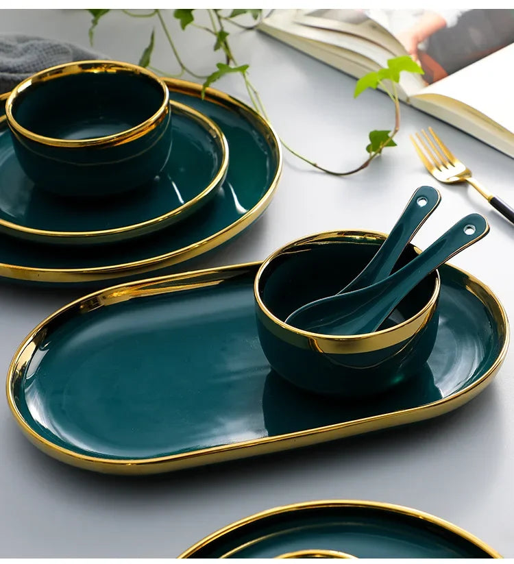 Green ceramic dinnerware set by MC THE BLACK DIAMOND featuring plates, bowls, and serving pieces for family meals.