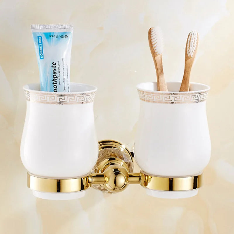 Luxury gold polished brass bathroom accessories set including soap dispenser, toothbrush holder, and tumbler from MC THE BLACK DIAMOND